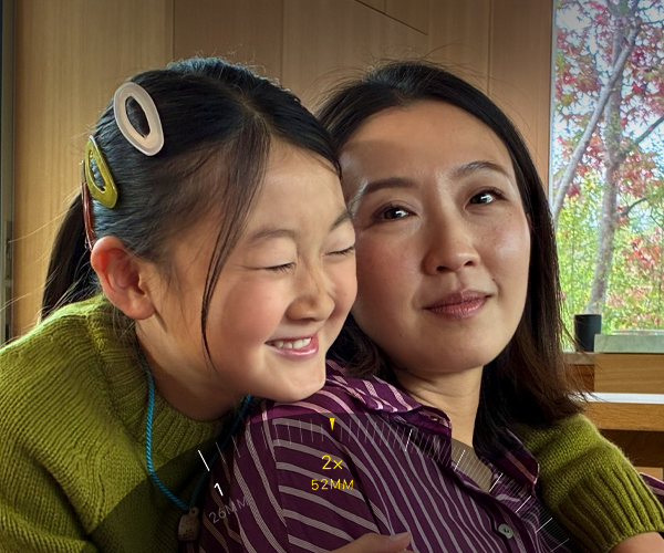 2x tele-funksjonen blir brukt til å zoome inn på et skogdekt fjell.